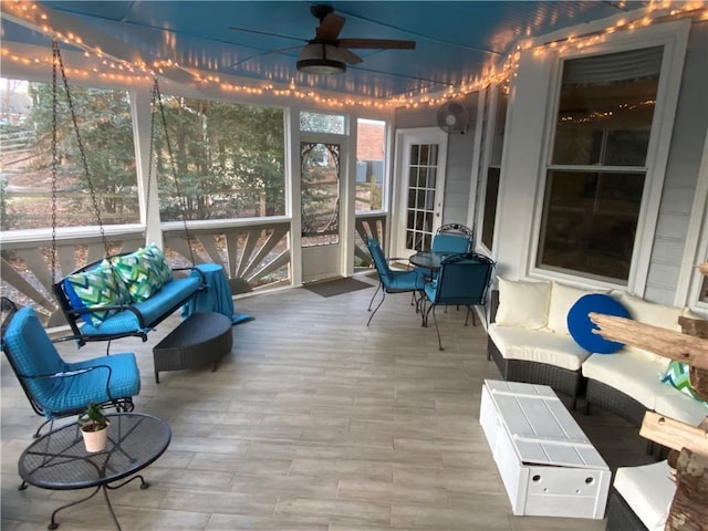 sunroom / solarium with ceiling fan