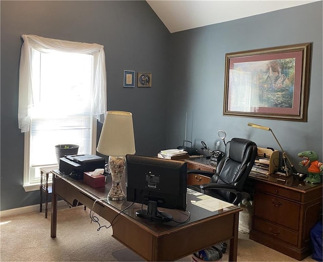 office with light carpet and vaulted ceiling