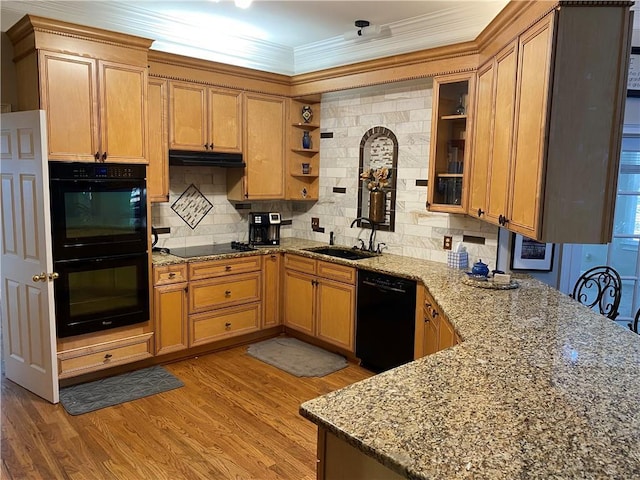 kitchen with light stone countertops, black appliances, light hardwood / wood-style floors, crown molding, and sink