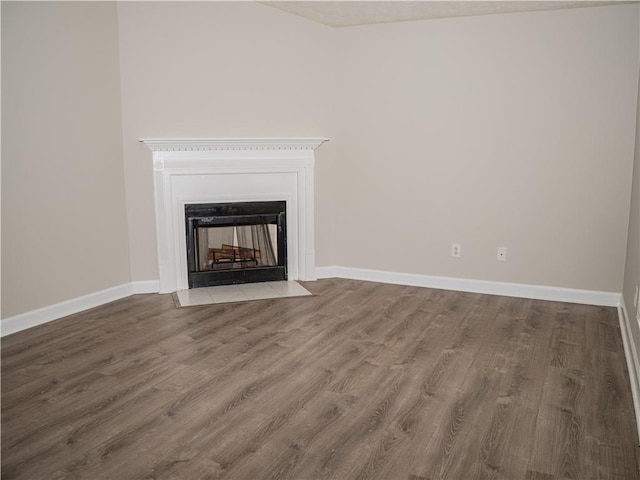 unfurnished living room featuring hardwood / wood-style floors