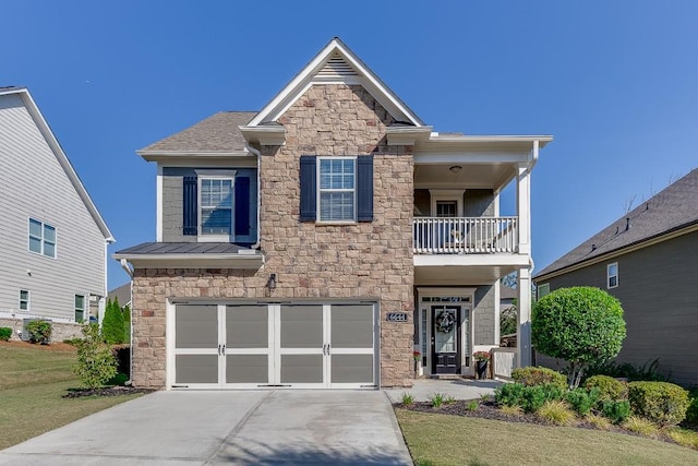 view of front of home featuring a garage and a balcony