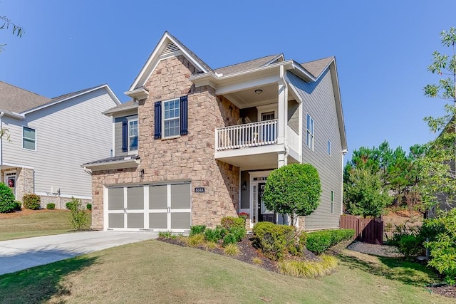 view of front of house featuring a balcony, a garage, and a front lawn