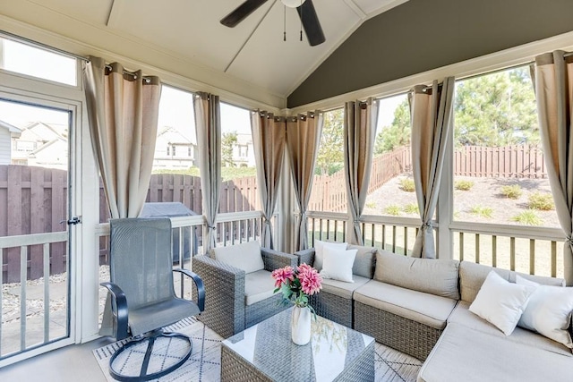 sunroom / solarium with ceiling fan and lofted ceiling