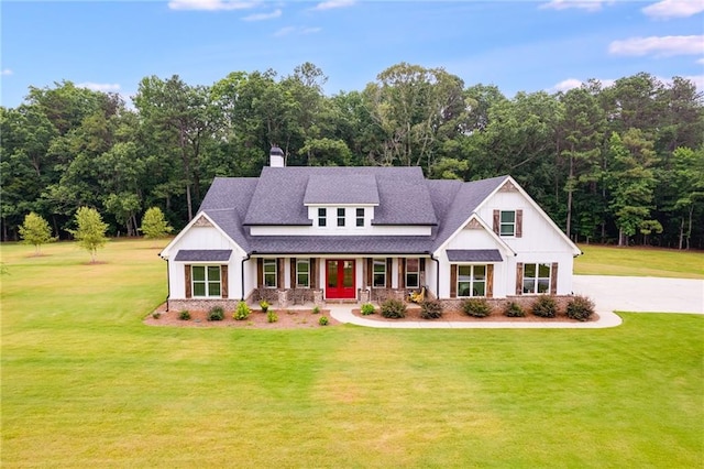 view of front of property with a porch and a front lawn