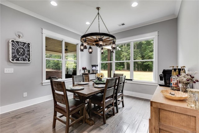 dining room featuring crown molding and wood-type flooring