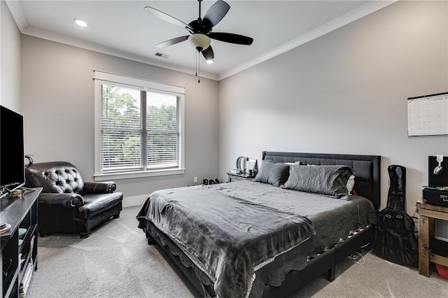 bedroom with crown molding, light colored carpet, and ceiling fan