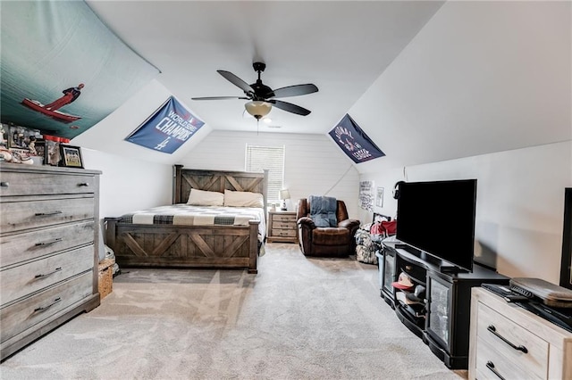 bedroom featuring vaulted ceiling, ceiling fan, and carpet