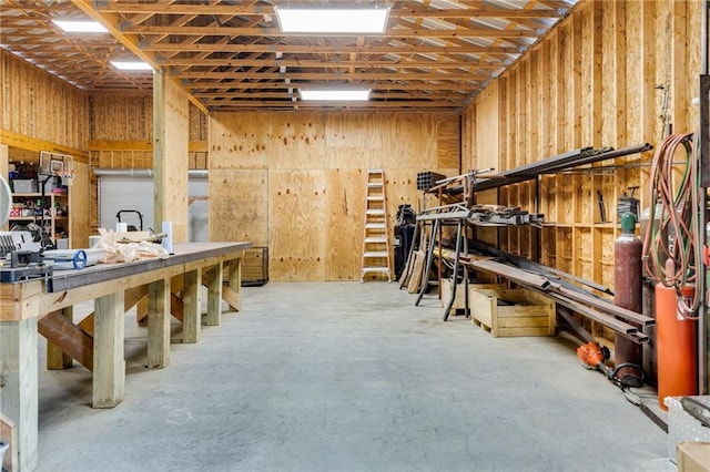 interior space with concrete floors and a workshop area