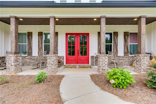 doorway to property featuring french doors and a porch