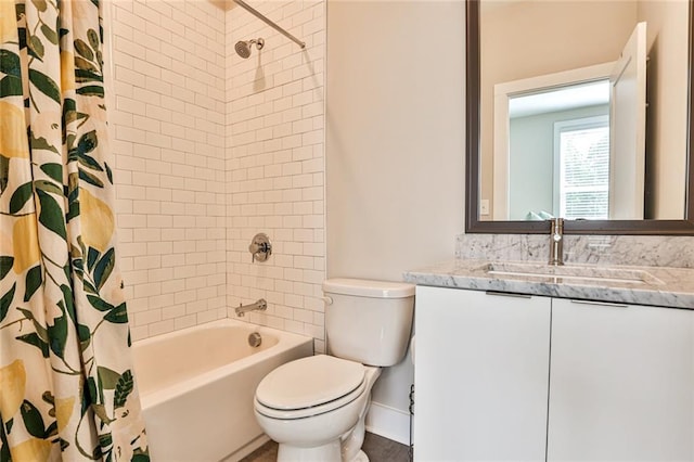 bathroom featuring shower / bath combo with shower curtain, toilet, and vanity