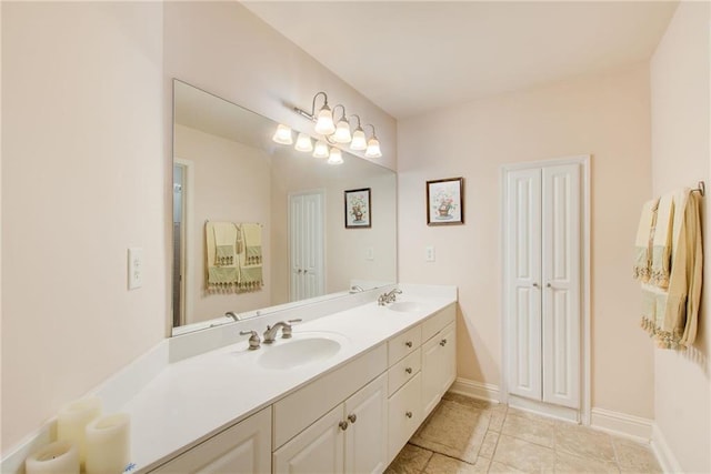 bathroom with tile patterned floors and vanity