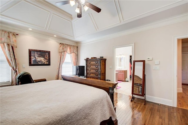 bedroom with ceiling fan, ornamental molding, light hardwood / wood-style floors, and ensuite bath