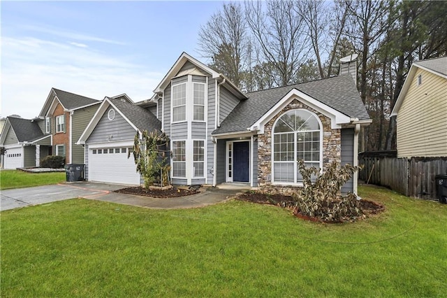 view of front property with a garage and a front yard