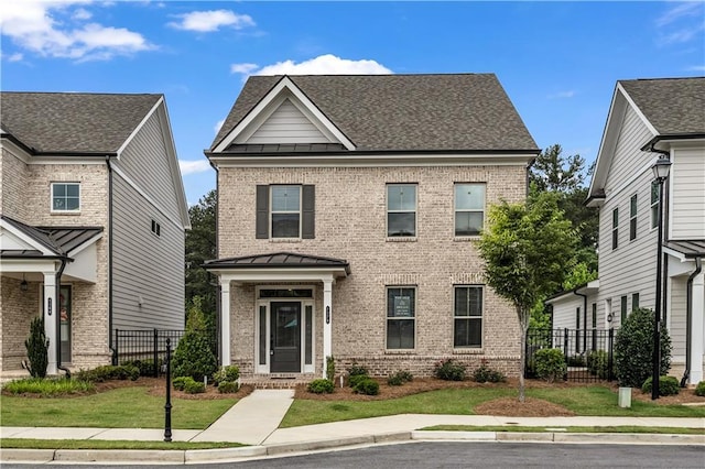 1179 Bennett Creek Overlook, Suwanee, GA 30024 - view of front facade featuring brick siding, a standing seam roof, and metal roof