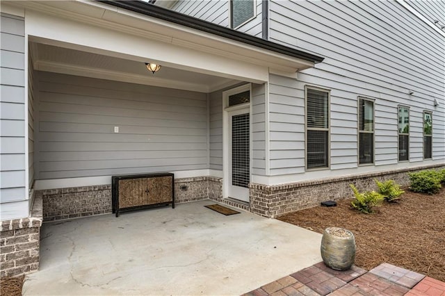 1179 Bennett Creek Overlook, Suwanee, GA 30024 - view of exterior entry with a patio