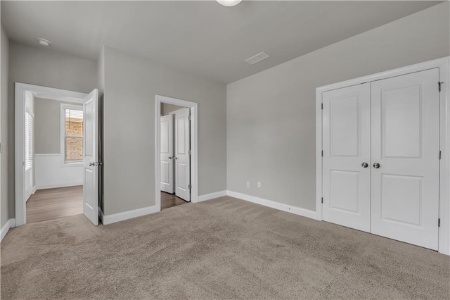 1179 Bennett Creek Overlook, Suwanee, GA 30024 - unfurnished bedroom featuring carpet, baseboards, and a closet