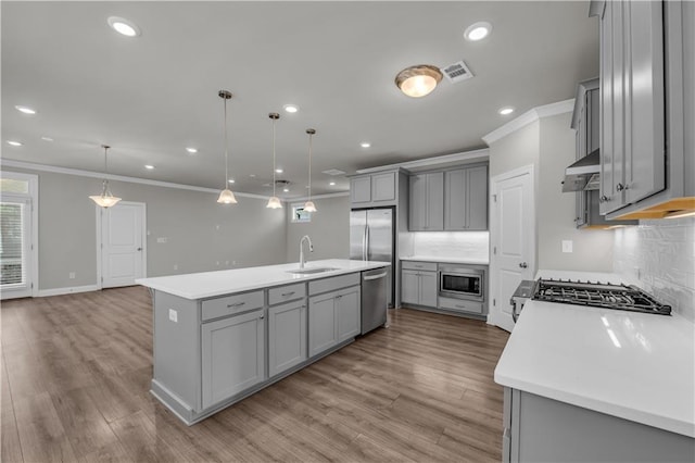 1179 Bennett Creek Overlook, Suwanee, GA 30024 - kitchen featuring gray cabinets, stainless steel appliances, crown molding, decorative backsplash, and a sink