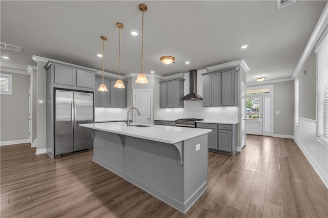 1179 Bennett Creek Overlook, Suwanee, GA 30024 - kitchen with stainless steel appliances, gray cabinetry, wall chimney range hood, ornamental molding, and a sink