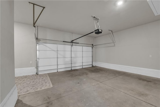 1179 Bennett Creek Overlook, Suwanee, GA 30024 - garage featuring a garage door opener and baseboards