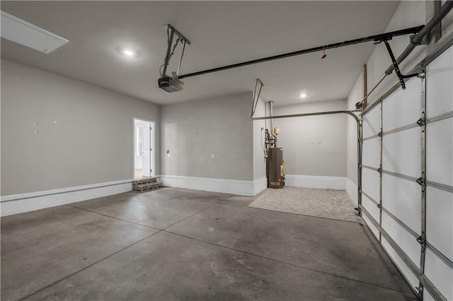 1179 Bennett Creek Overlook, Suwanee, GA 30024 - garage featuring a garage door opener, gas water heater, baseboards, and recessed lighting