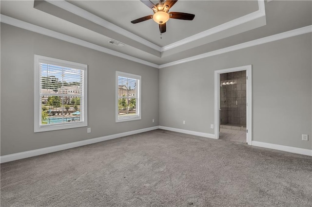 1179 Bennett Creek Overlook, Suwanee, GA 30024 - spare room with a tray ceiling, carpet flooring, baseboards, ceiling fan, and crown molding