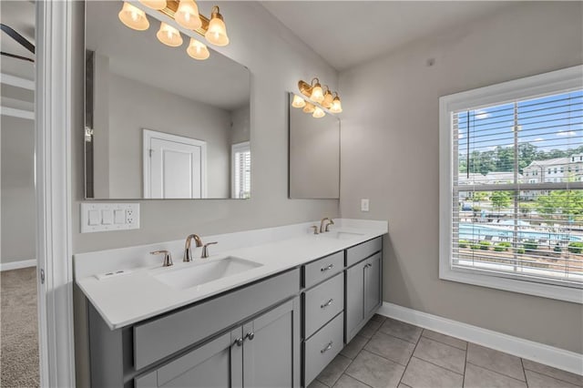 1179 Bennett Creek Overlook, Suwanee, GA 30024 - bathroom with double vanity, baseboards, a chandelier, and tile patterned floors