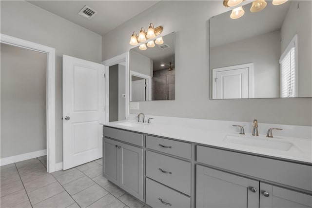 1179 Bennett Creek Overlook, Suwanee, GA 30024 - bathroom featuring double vanity, tile patterned floors, baseboards, and a chandelier