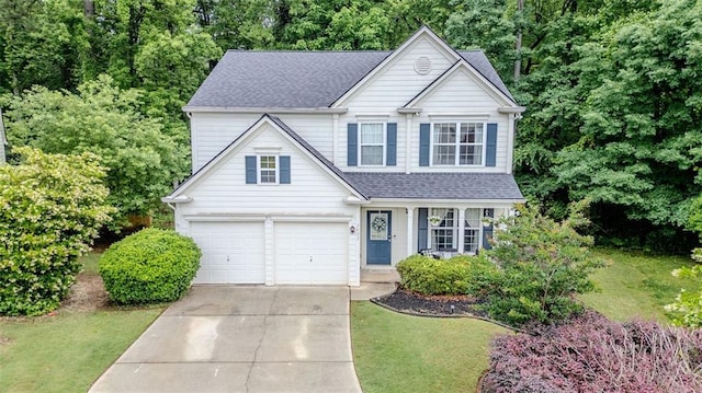 2022 Maple Ridge Dr NW, Acworth, GA 30101 - traditional-style home featuring concrete driveway, a front yard, a shingled roof, and a garage