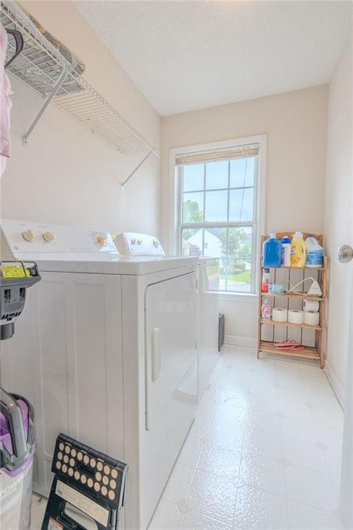2022 Maple Ridge Dr NW, Acworth, GA 30101 - laundry room featuring washer and clothes dryer, light floors, and baseboards