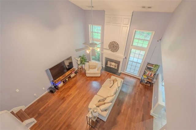 2022 Maple Ridge Dr NW, Acworth, GA 30101 - living room featuring wood finished floors, a fireplace with flush hearth, and ceiling fan
