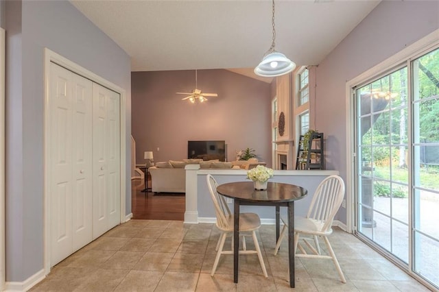 2022 Maple Ridge Dr NW, Acworth, GA 30101 - dining space with lofted ceiling, light tile patterned floors, ceiling fan, and baseboards