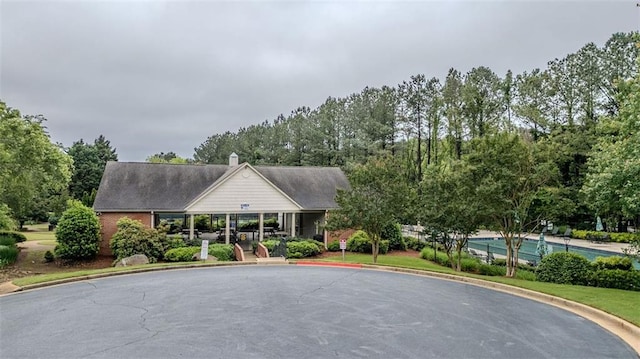 2022 Maple Ridge Dr NW, Acworth, GA 30101 - view of building exterior featuring curved driveway and view of wooded area