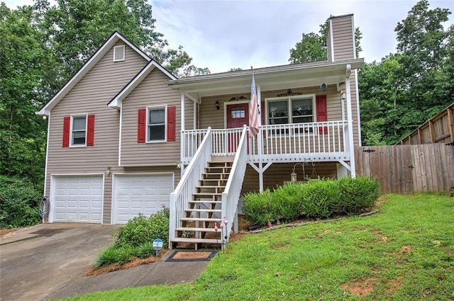 80 Broadlands Dr, White, GA 30184 - view of front of property featuring an attached garage, driveway, covered porch, stairway, and a chimney