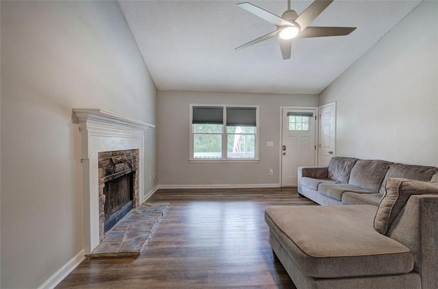 80 Broadlands Dr, White, GA 30184 - living room with ceiling fan, dark wood-style floors, lofted ceiling, and a stone fireplace