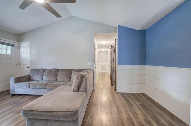 80 Broadlands Dr, White, GA 30184 - living room with a ceiling fan, a wainscoted wall, lofted ceiling, and wood finished floors