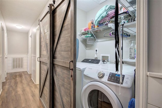 80 Broadlands Dr, White, GA 30184 - laundry room with independent washer and dryer and wood finished floors
