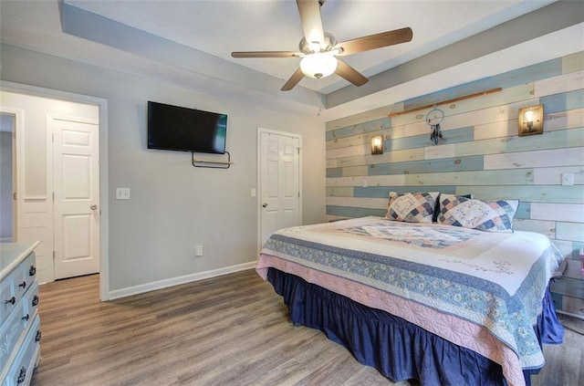 80 Broadlands Dr, White, GA 30184 - bedroom featuring wood finished floors, a raised ceiling, ceiling fan, and wood walls