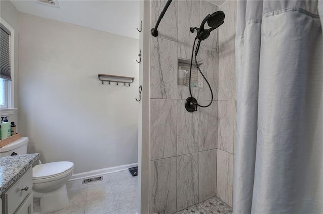 80 Broadlands Dr, White, GA 30184 - bathroom featuring tiled shower, vanity, and tile patterned floors