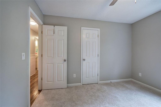 80 Broadlands Dr, White, GA 30184 - unfurnished bedroom featuring a textured ceiling, carpet floors, and ceiling fan