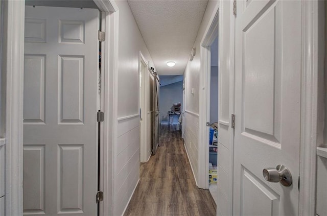 80 Broadlands Dr, White, GA 30184 - corridor with a textured ceiling and dark wood-style flooring