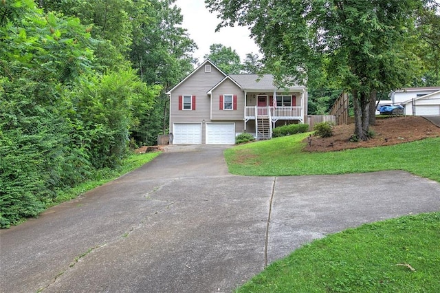 80 Broadlands Dr, White, GA 30184 - view of front of property featuring stairway, driveway, covered porch, a front lawn, and an attached garage