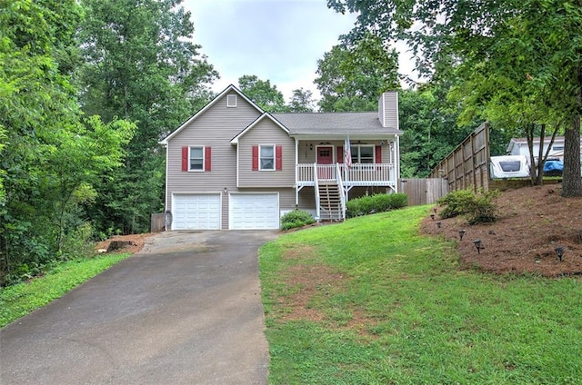 80 Broadlands Dr, White, GA 30184 - view of front facade with driveway, a chimney, stairway, an attached garage, and covered porch