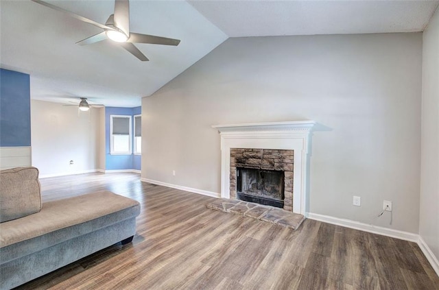 80 Broadlands Dr, White, GA 30184 - unfurnished living room with ceiling fan, wood finished floors, a stone fireplace, and lofted ceiling