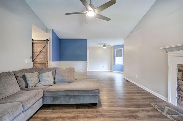 80 Broadlands Dr, White, GA 30184 - living room featuring a ceiling fan, a barn door, wood finished floors, and high vaulted ceiling