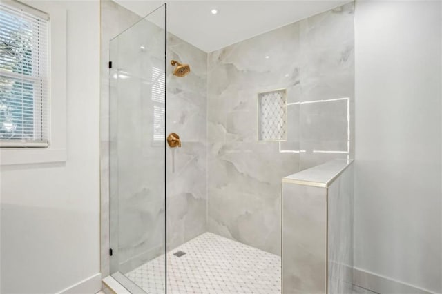 bathroom with tiled shower