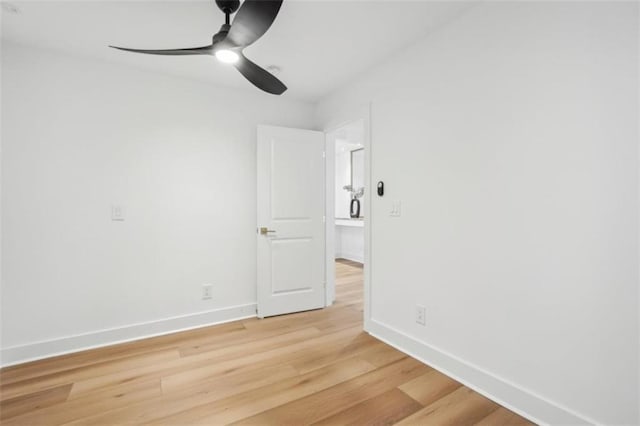 empty room featuring ceiling fan and light hardwood / wood-style floors