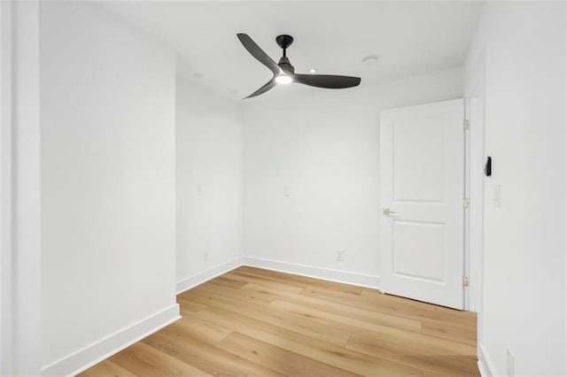 spare room with ceiling fan and hardwood / wood-style floors