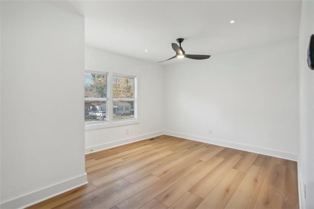 spare room with ceiling fan and light hardwood / wood-style flooring