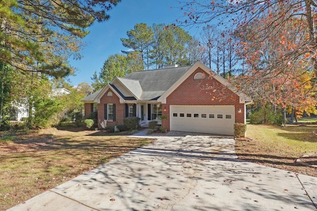 view of front of house with a front yard and a garage