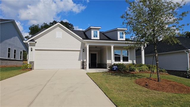 view of front of house with a front lawn, a porch, and a garage